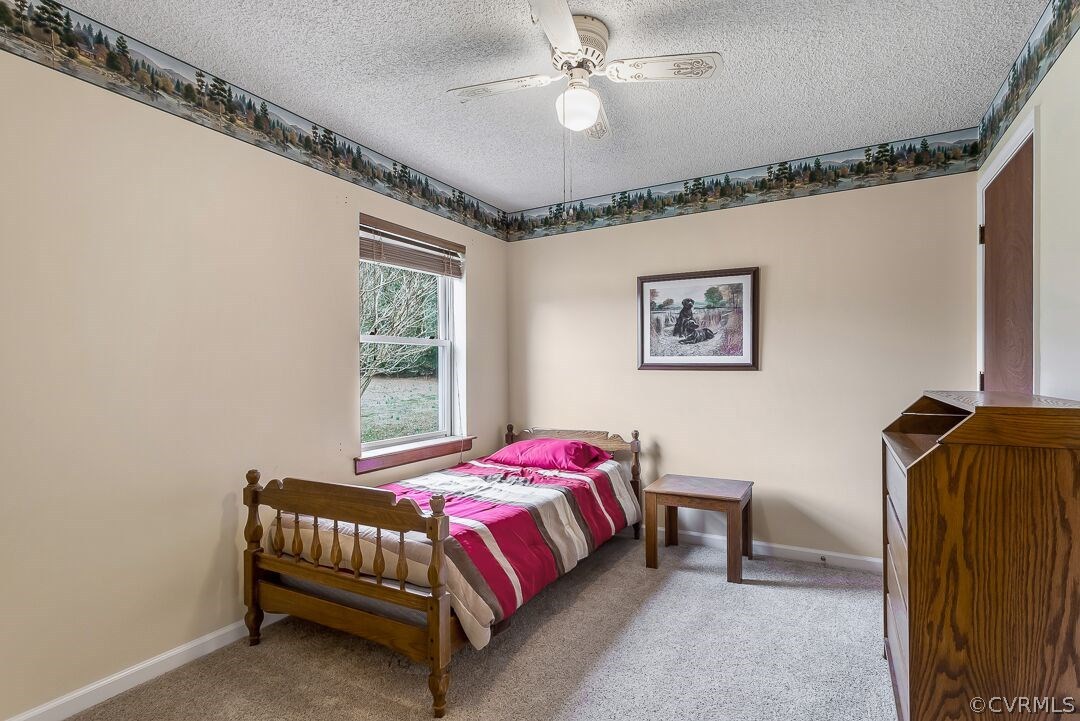 8338 Marye Road Partlow, VA 22534 - Photo 23 of 32 a bedroom with a bed and a window