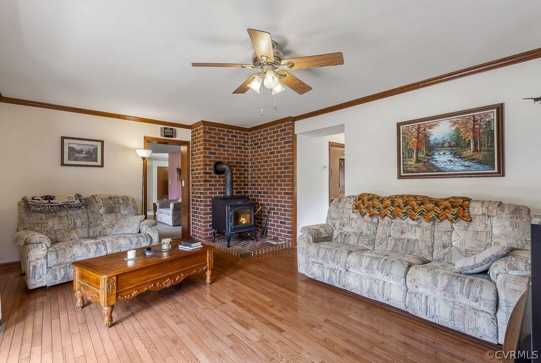 8338 Marye Road Partlow, VA 22534 - Photo 9 of 32 a living room with furniture and a fireplace