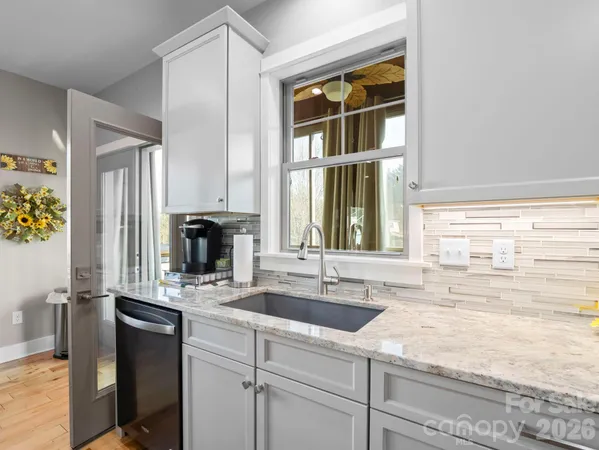 a bathroom with a sink and a window