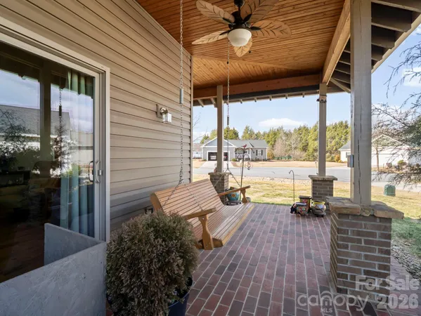 a view of balcony with couch and wooden floor