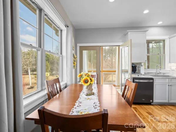 a dining room with furniture window and outdoor space