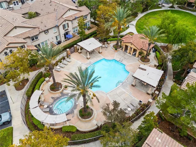 an aerial view of a house with a swimming pool