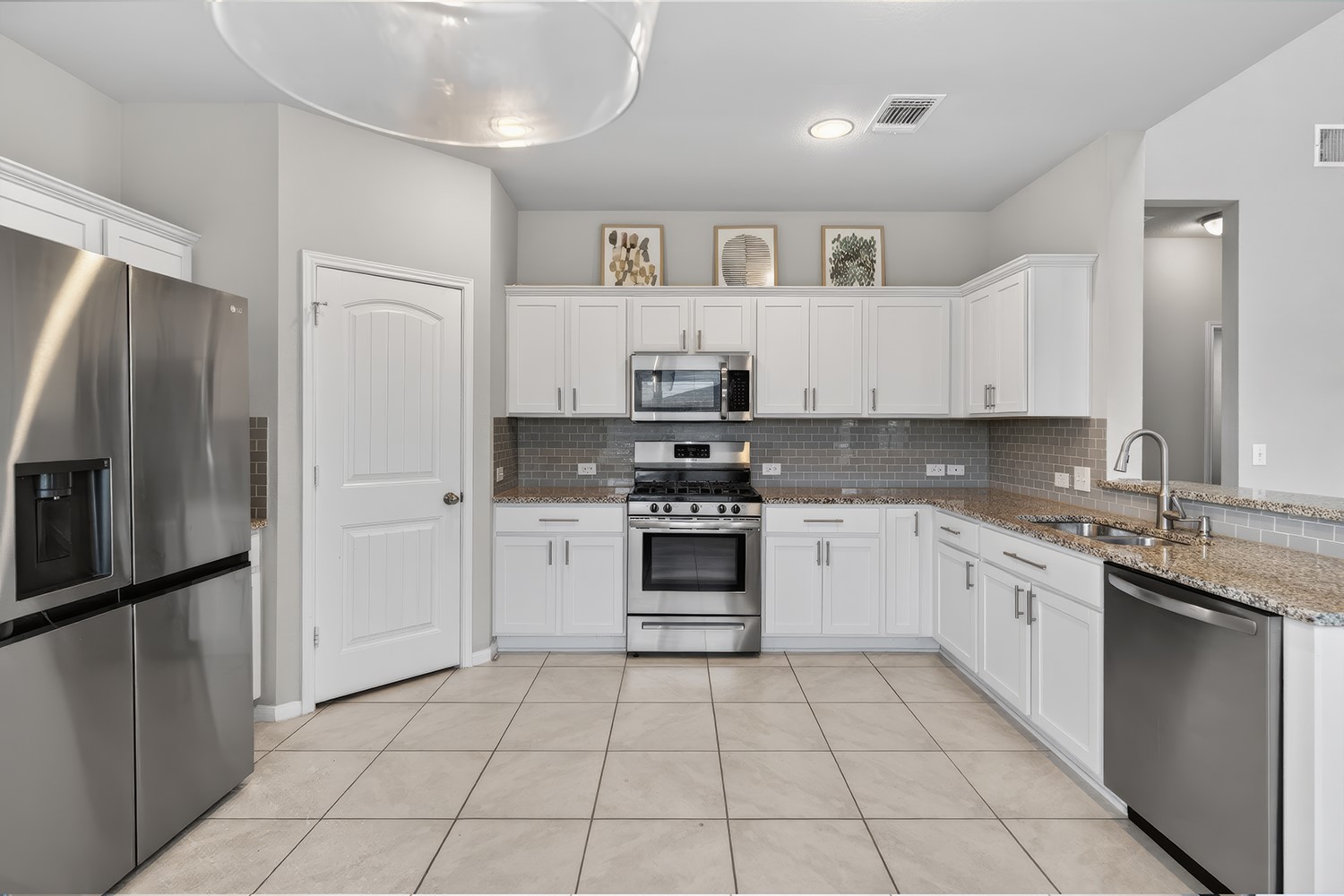 2006 Grow Lane Austin, TX 78754 - Photo 9 of 40 A well-equipped culinary space awaits, boasting ample storage and modern stainless appliances.