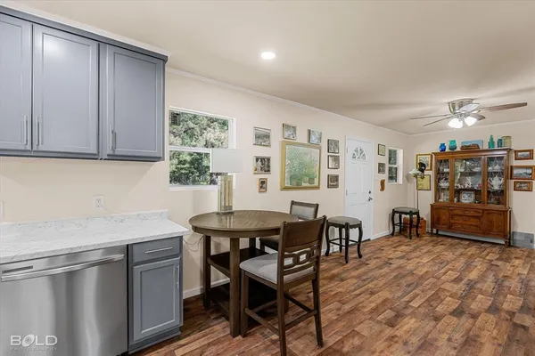 a kitchen with a sink and wooden cabinets