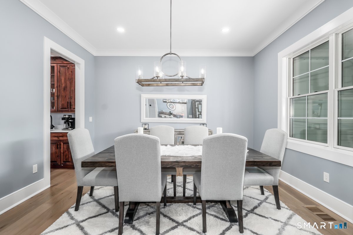 2 Pond View Lane Sherman, CT 06784 - Photo 15 of 40 a dining room with furniture a chandelier and window