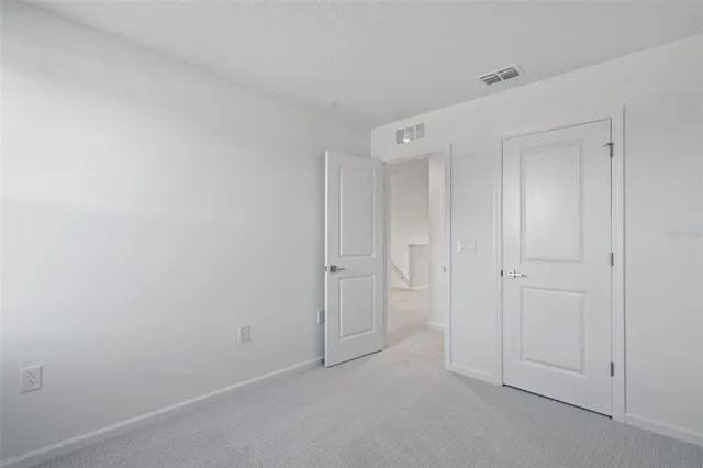 a bathroom with a granite countertop sink a toilet and a bathtub