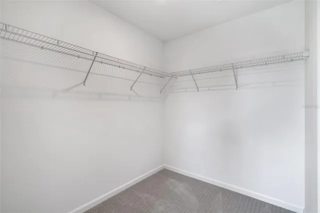 a bathroom with a double vanity sink mirror and shower