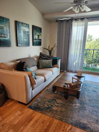 a living room with furniture and a window