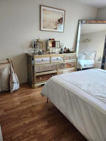 a bedroom with a bed and a cabinets