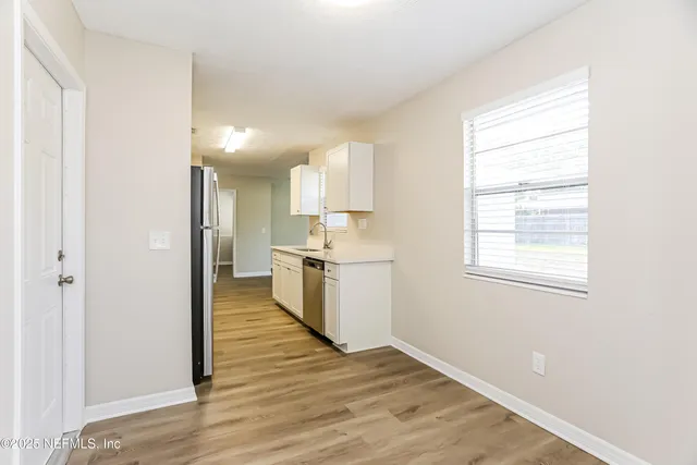 a view of a kitchen with a window