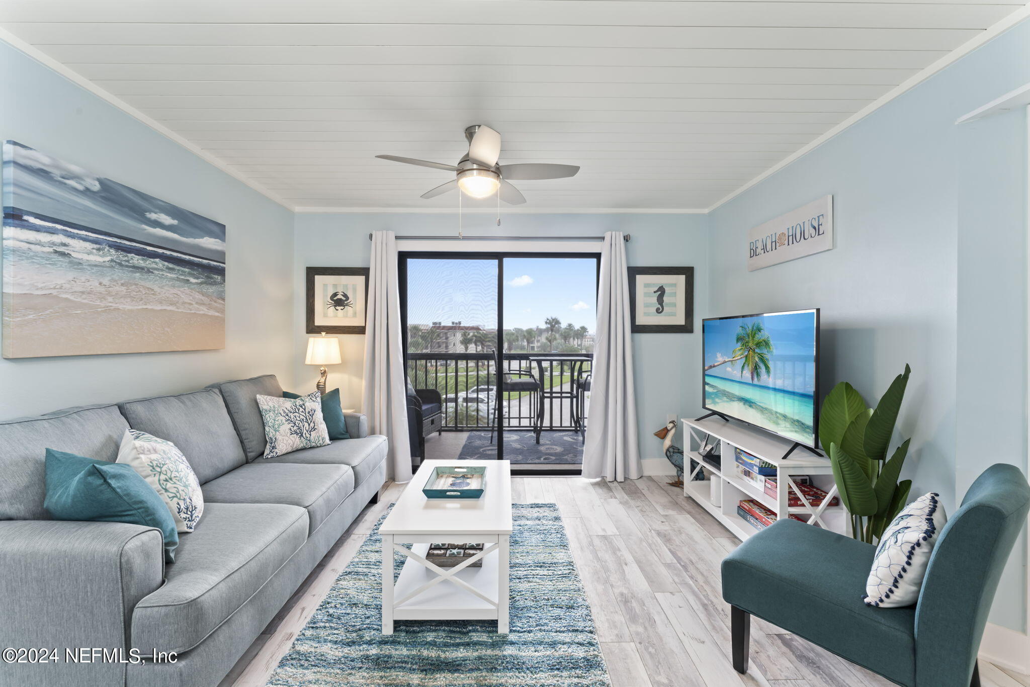 4250 Florida A1A, Unit M35 St. Augustine, FL 32080 - Photo 11 of 57 a living room with furniture and a flat screen tv