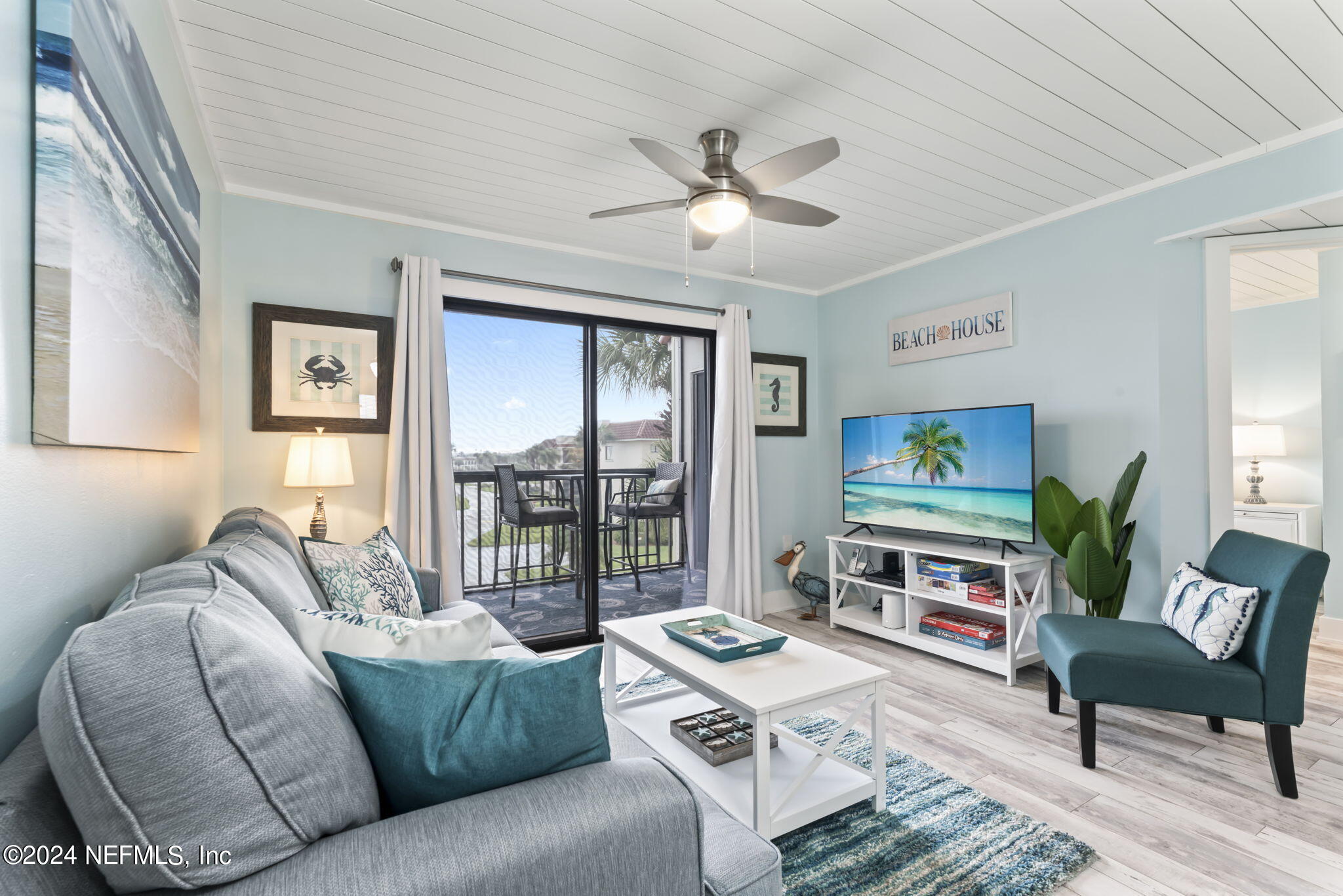 4250 Florida A1A, Unit M35 St. Augustine, FL 32080 - Photo 12 of 57 a living room with furniture ceiling fan and a window