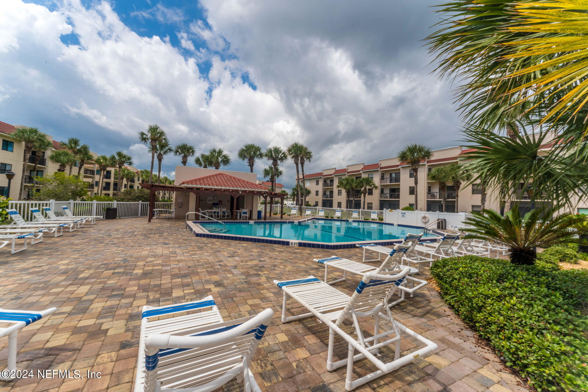 4250 Florida A1A, Unit M35 St. Augustine, FL 32080 - Photo 43 of 57 a view of a patio with table and chairs and potted plants