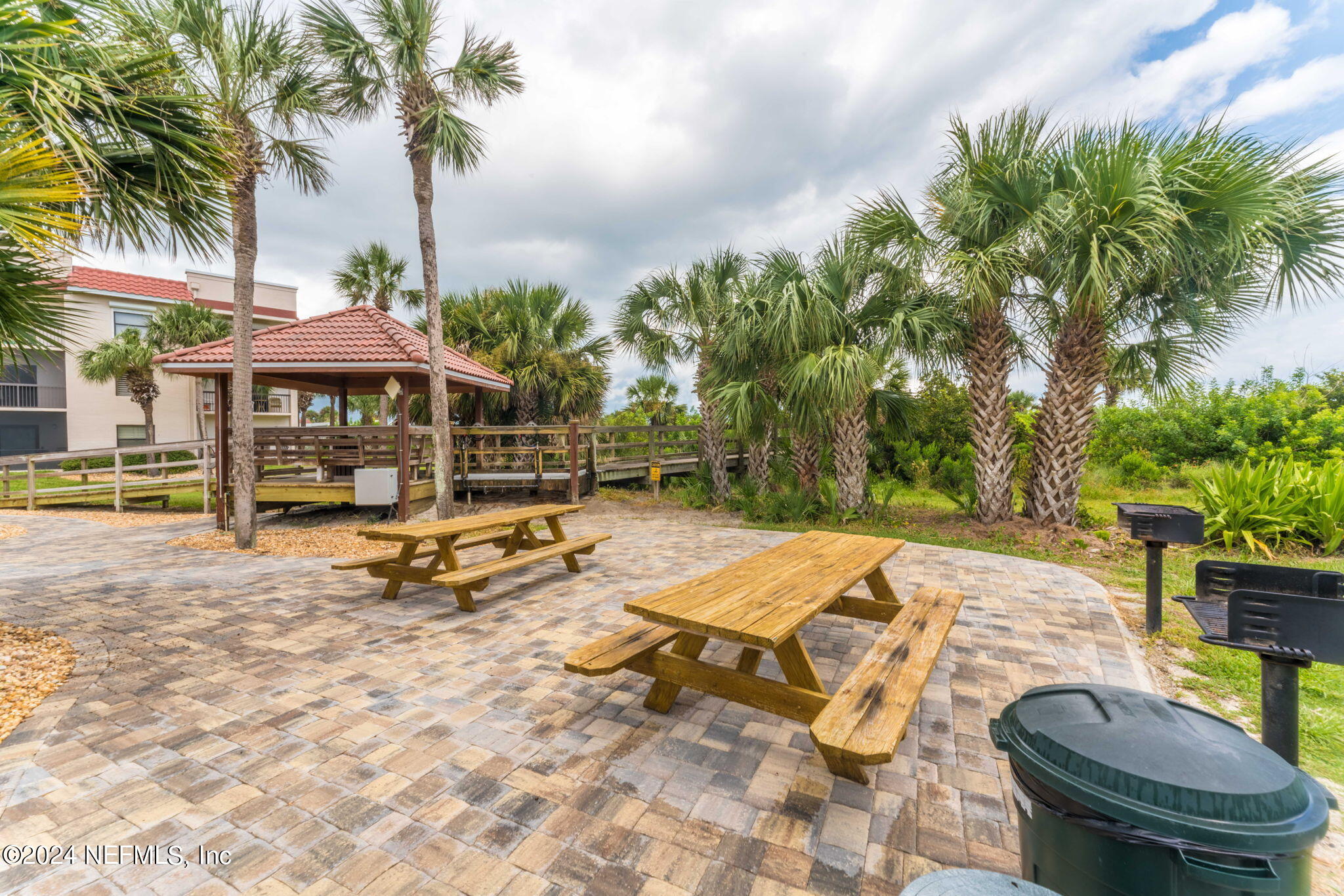 4250 Florida A1A, Unit M35 St. Augustine, FL 32080 - Photo 44 of 57 a view of a patio with swimming pool table and chairs