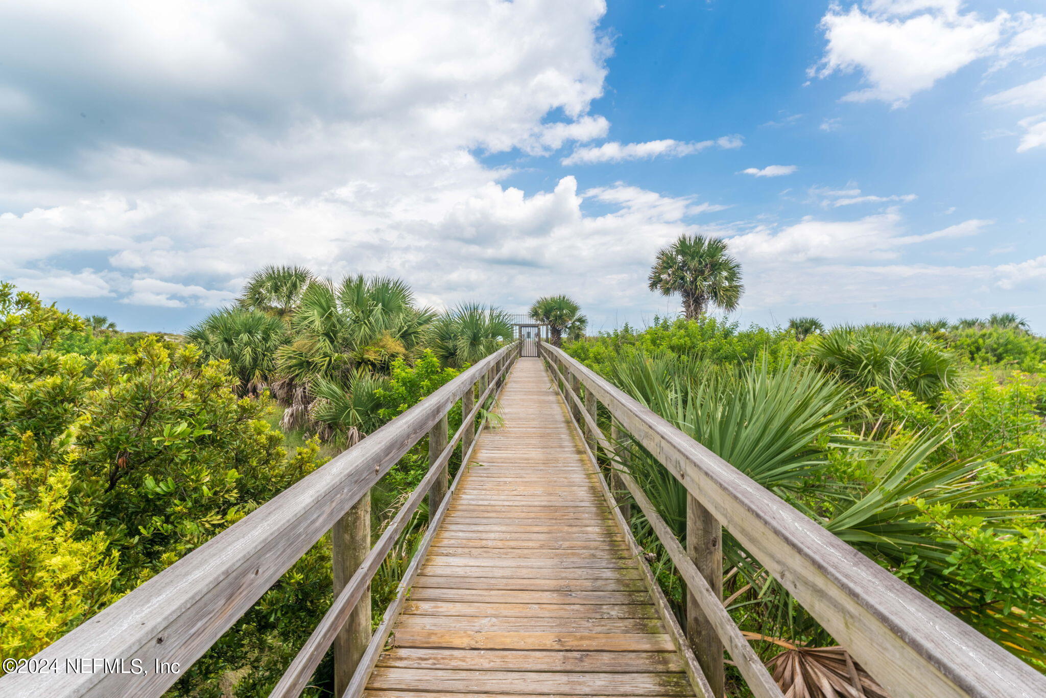 4250 Florida A1A, Unit M35 St. Augustine, FL 32080 - Photo 47 of 57 a view of a balcony with wooden floor and fence