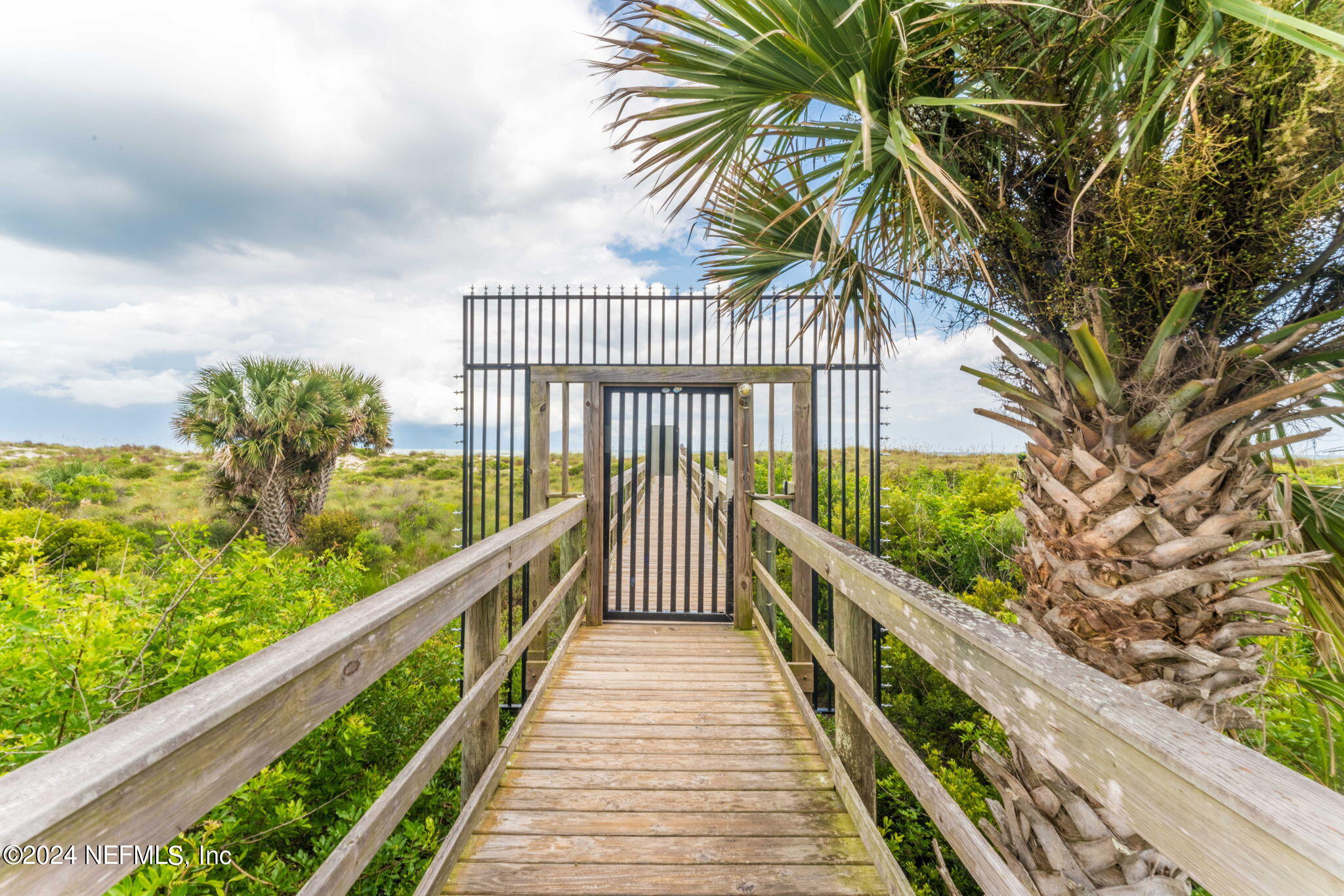4250 Florida A1A, Unit M35 St. Augustine, FL 32080 - Photo 48 of 57 a view of balcony with wooden floor and fence