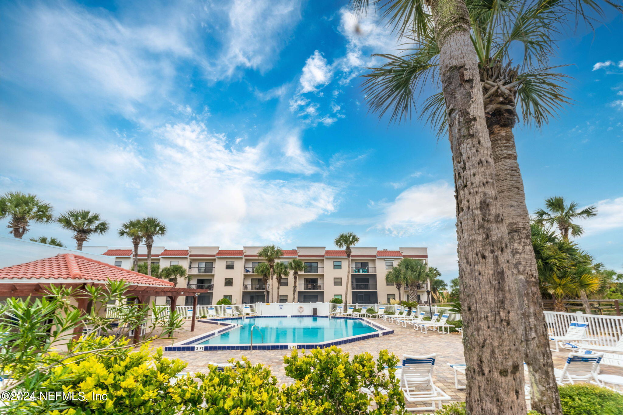 4250 Florida A1A, Unit M35 St. Augustine, FL 32080 - Photo 52 of 57 a view of a swimming pool with a garden