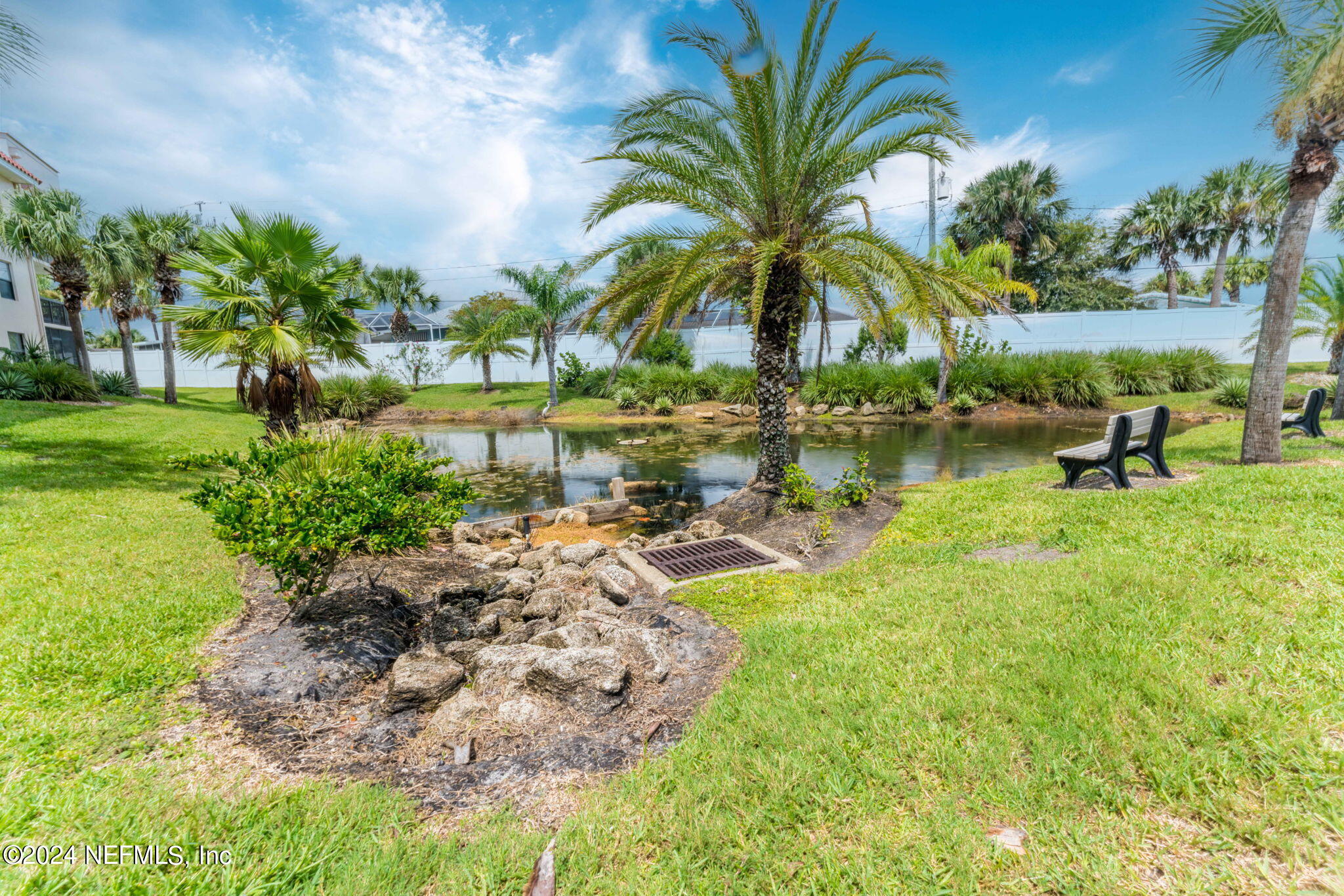 4250 Florida A1A, Unit M35 St. Augustine, FL 32080 - Photo 53 of 57 a view of swimming pool with outdoor seating and lake