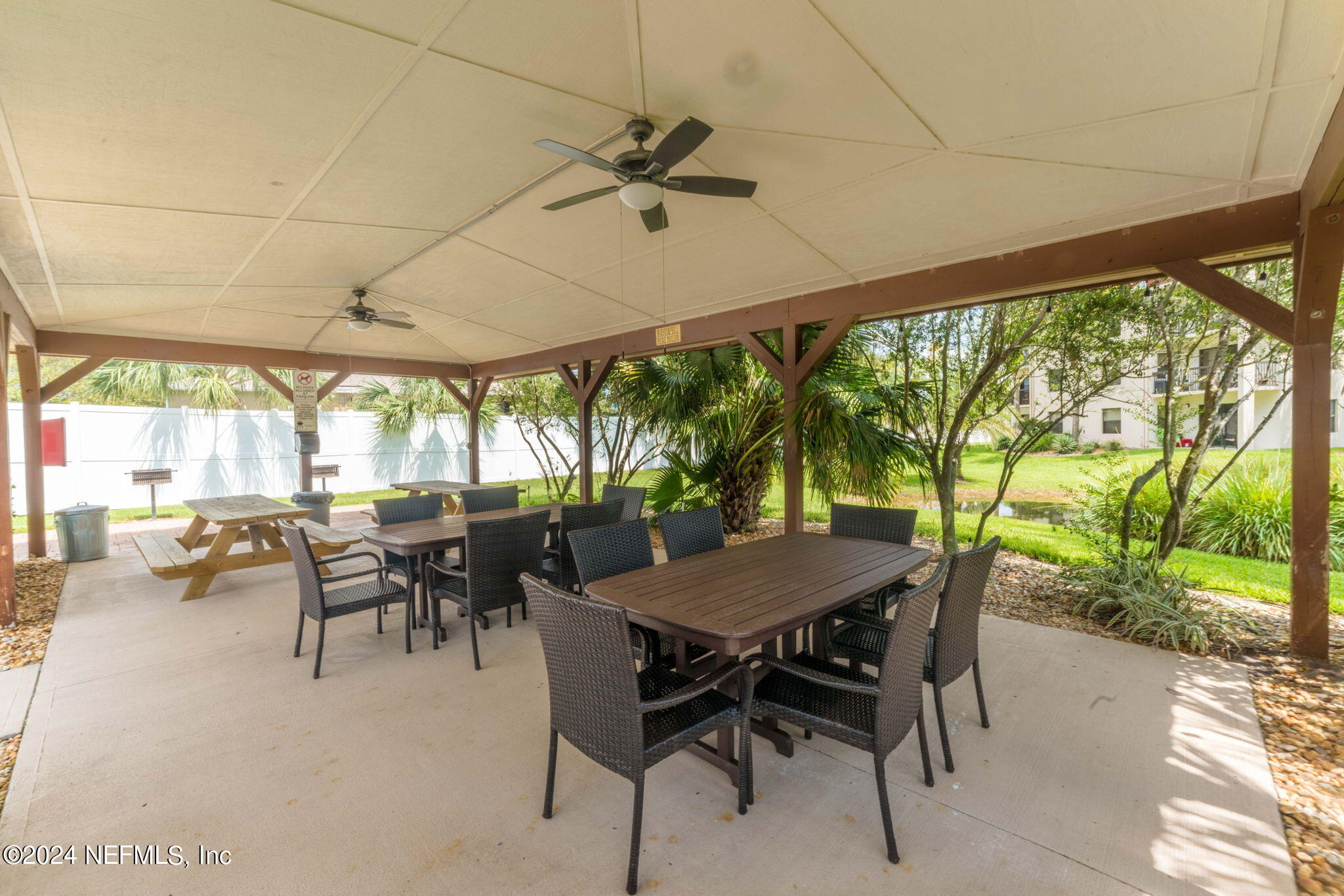 4250 Florida A1A, Unit M35 St. Augustine, FL 32080 - Photo 56 of 57 a dining room with furniture and a garden view