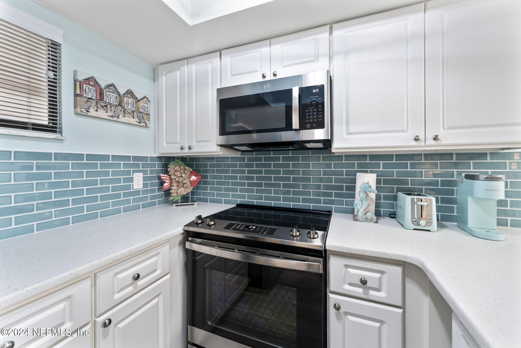 4250 Florida A1A, Unit M35 St. Augustine, FL 32080 - Photo 7 of 57 a kitchen with stainless steel appliances a stove a microwave sink and cabinets