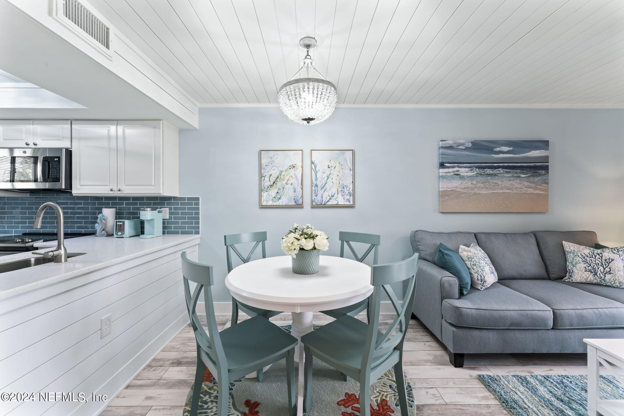 4250 Florida A1A, Unit M35 St. Augustine, FL 32080 - Photo 10 of 57 a living room with furniture a dining table and chairs