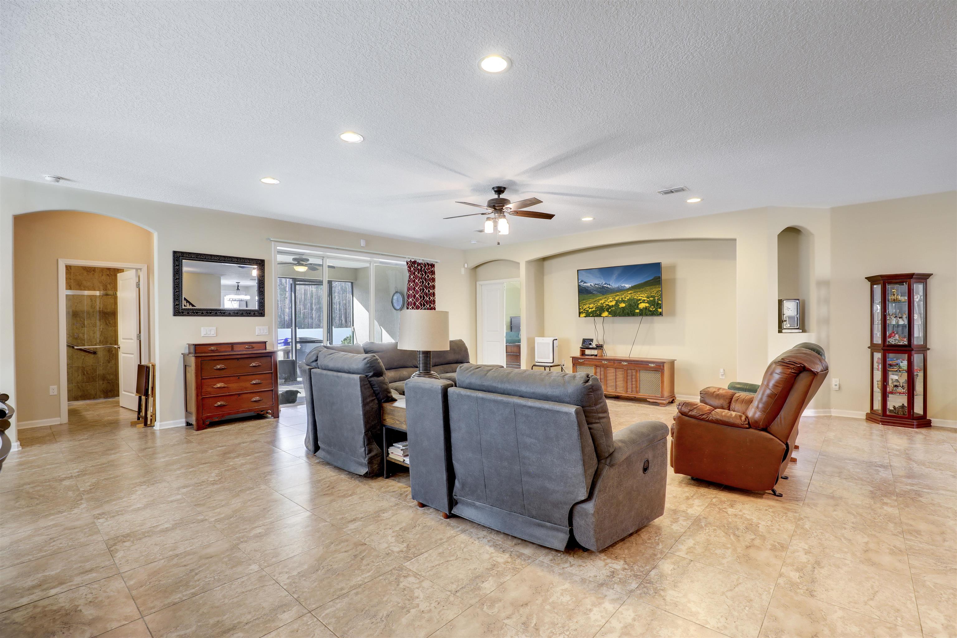 200 Ellsworth Circle St. Johns, FL 32259 - Photo 15 of 58 a living room with furniture and a flat screen tv