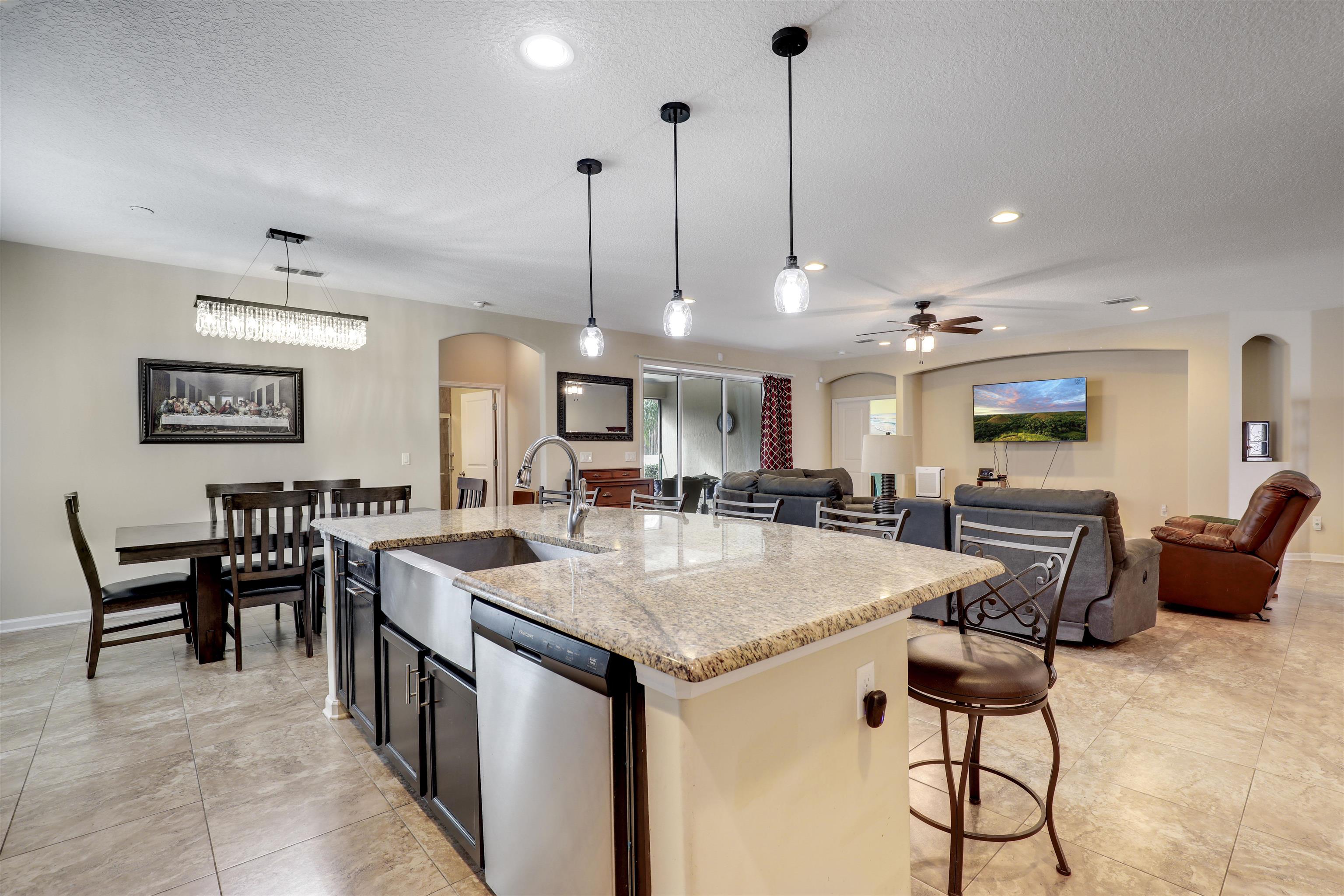 200 Ellsworth Circle St. Johns, FL 32259 - Photo 18 of 58 a kitchen with stainless steel appliances granite countertop table chairs and a view of living room