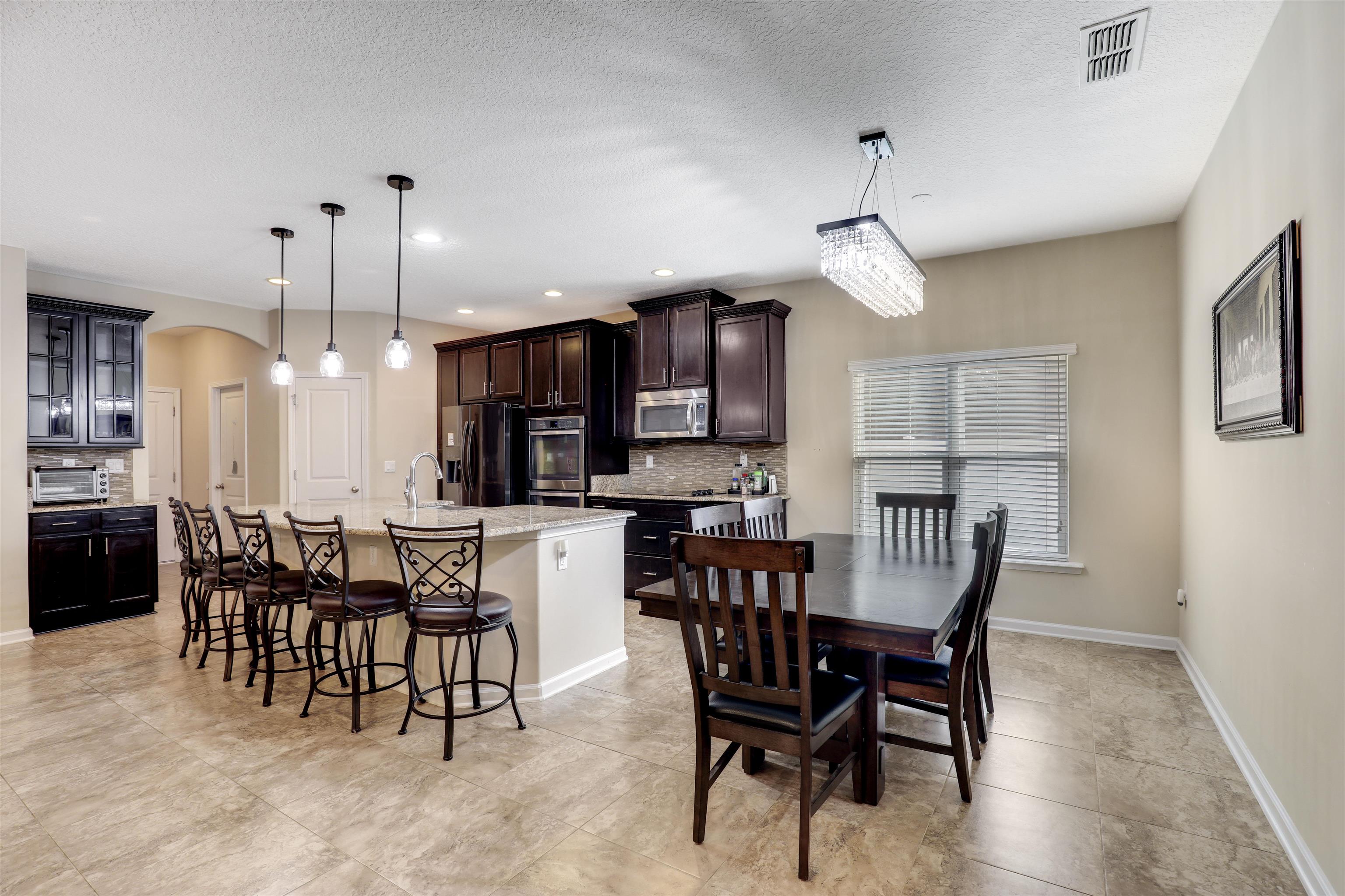 200 Ellsworth Circle St. Johns, FL 32259 - Photo 2 of 58 a view of a dining room with furniture