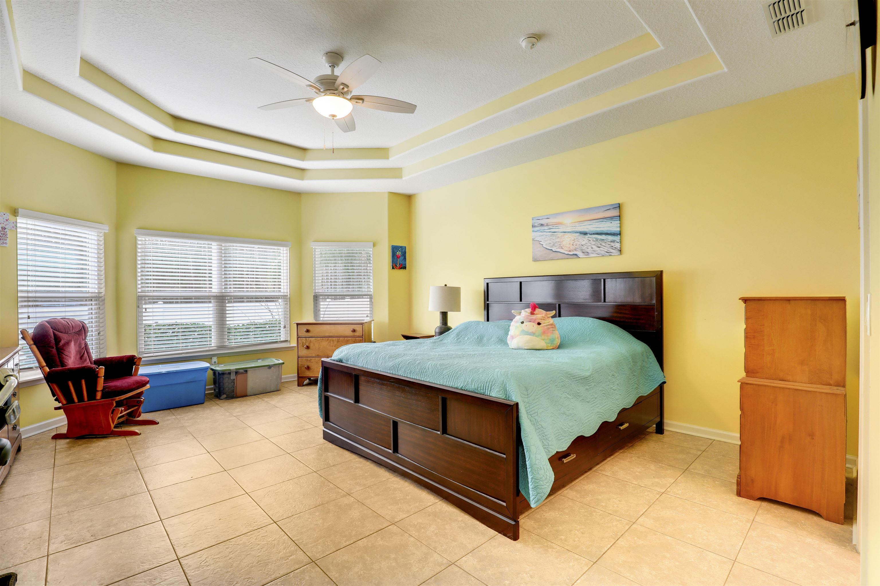 200 Ellsworth Circle St. Johns, FL 32259 - Photo 25 of 58 a bedroom with a bed and a chandelier
