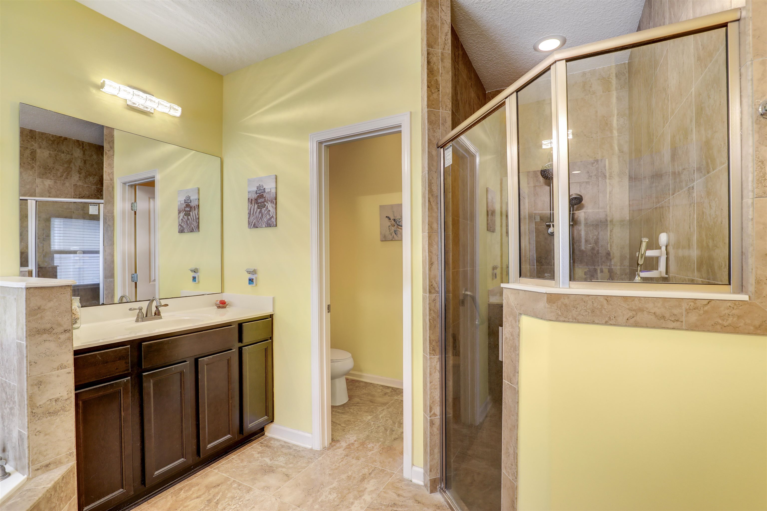 200 Ellsworth Circle St. Johns, FL 32259 - Photo 28 of 58 a bathroom with a double vanity sink a mirror and a bathtub