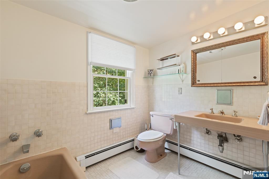 223 Terrace Road Franklin Lakes, NJ 07417 - Photo 23 of 35 a bathroom with a sink mirror vanity and toilet