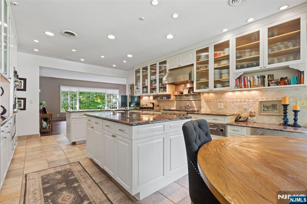 223 Terrace Road Franklin Lakes, NJ 07417 - Photo 9 of 35 a kitchen with stainless steel appliances granite countertop a sink and a large window