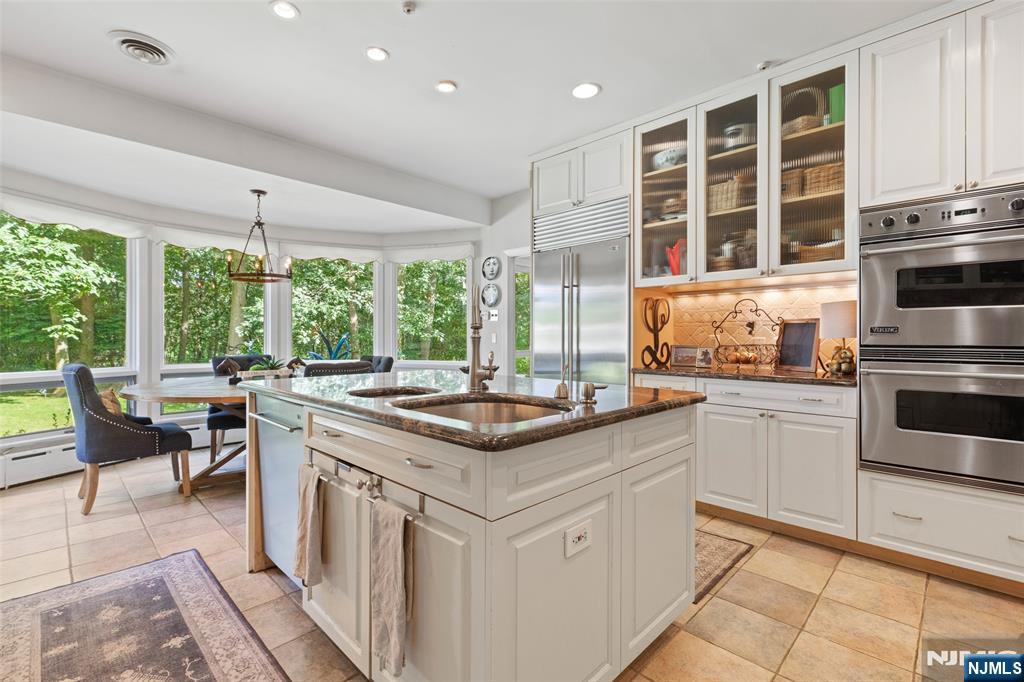 223 Terrace Road Franklin Lakes, NJ 07417 - Photo 10 of 35 a kitchen with stainless steel appliances granite countertop a stove and a sink