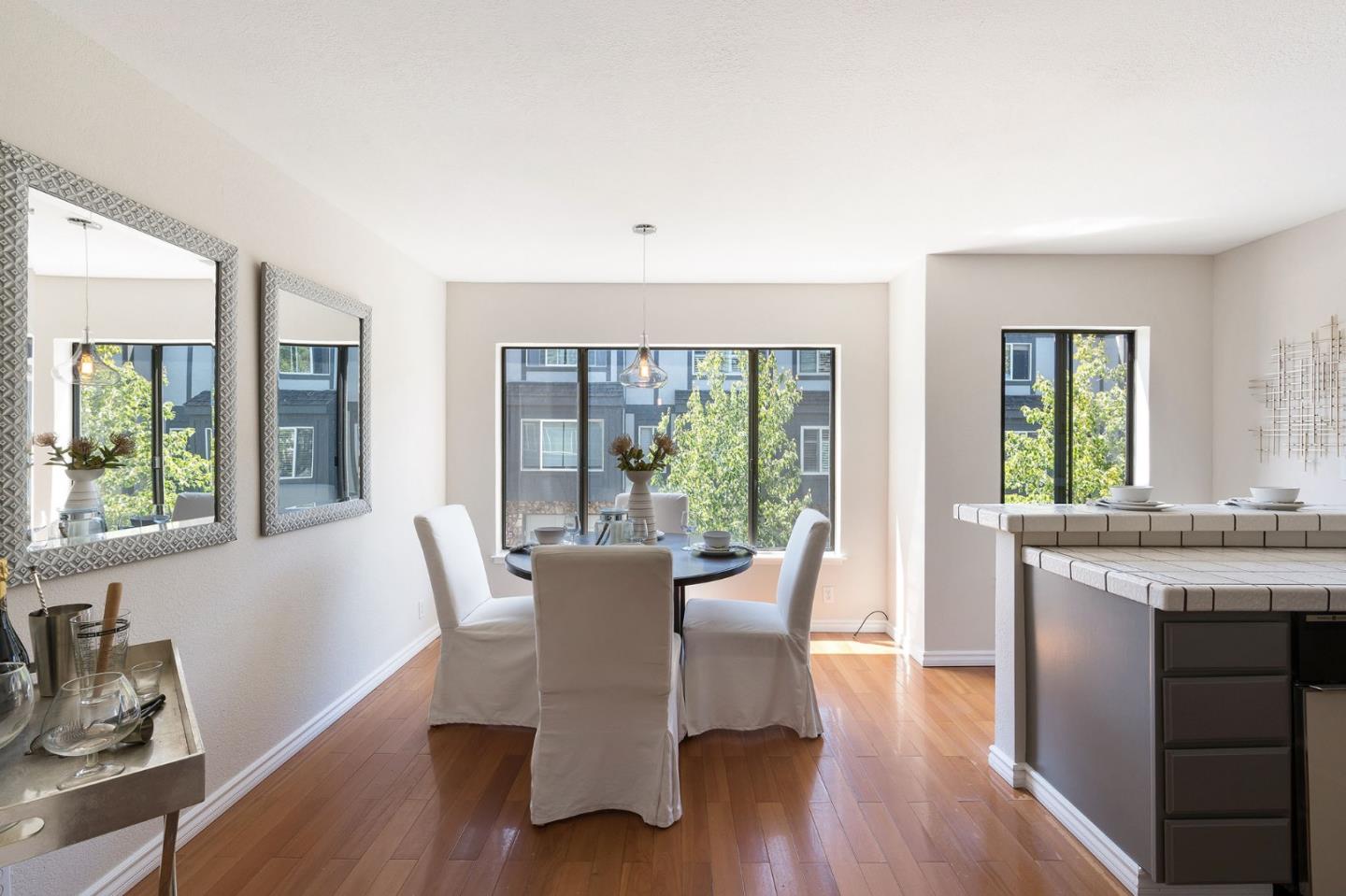 33 Park Road, Unit 13 Burlingame, CA 94010 - Photo 13 of 43 a view of a dining room with furniture window and wooden floor
