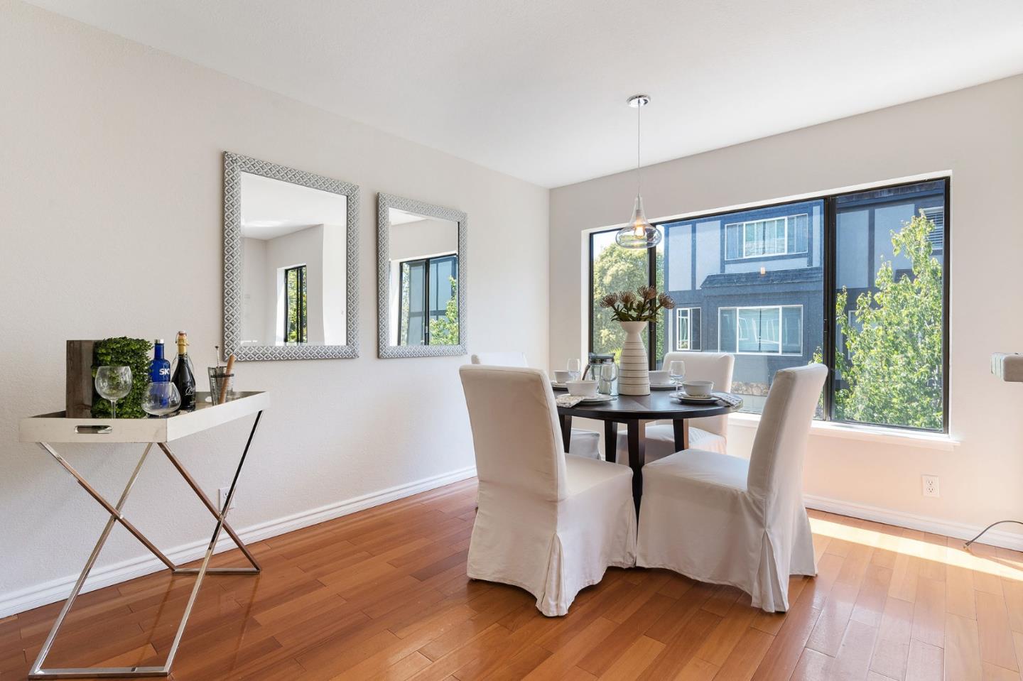 33 Park Road, Unit 13 Burlingame, CA 94010 - Photo 14 of 43 a dining room with furniture window and wooden floor