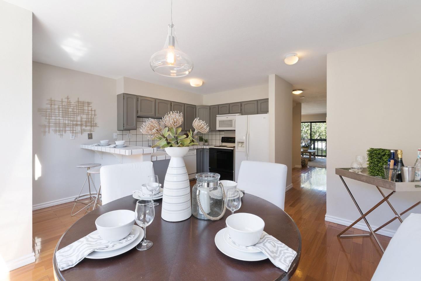 33 Park Road, Unit 13 Burlingame, CA 94010 - Photo 15 of 43 a view of a dining room with furniture