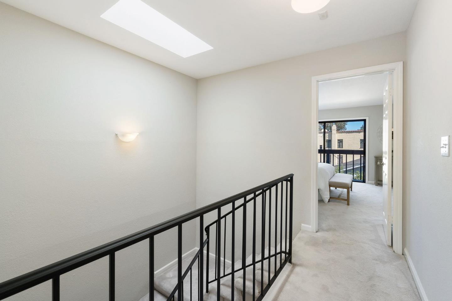 33 Park Road, Unit 13 Burlingame, CA 94010 - Photo 23 of 43 a view of a hallway with seating area