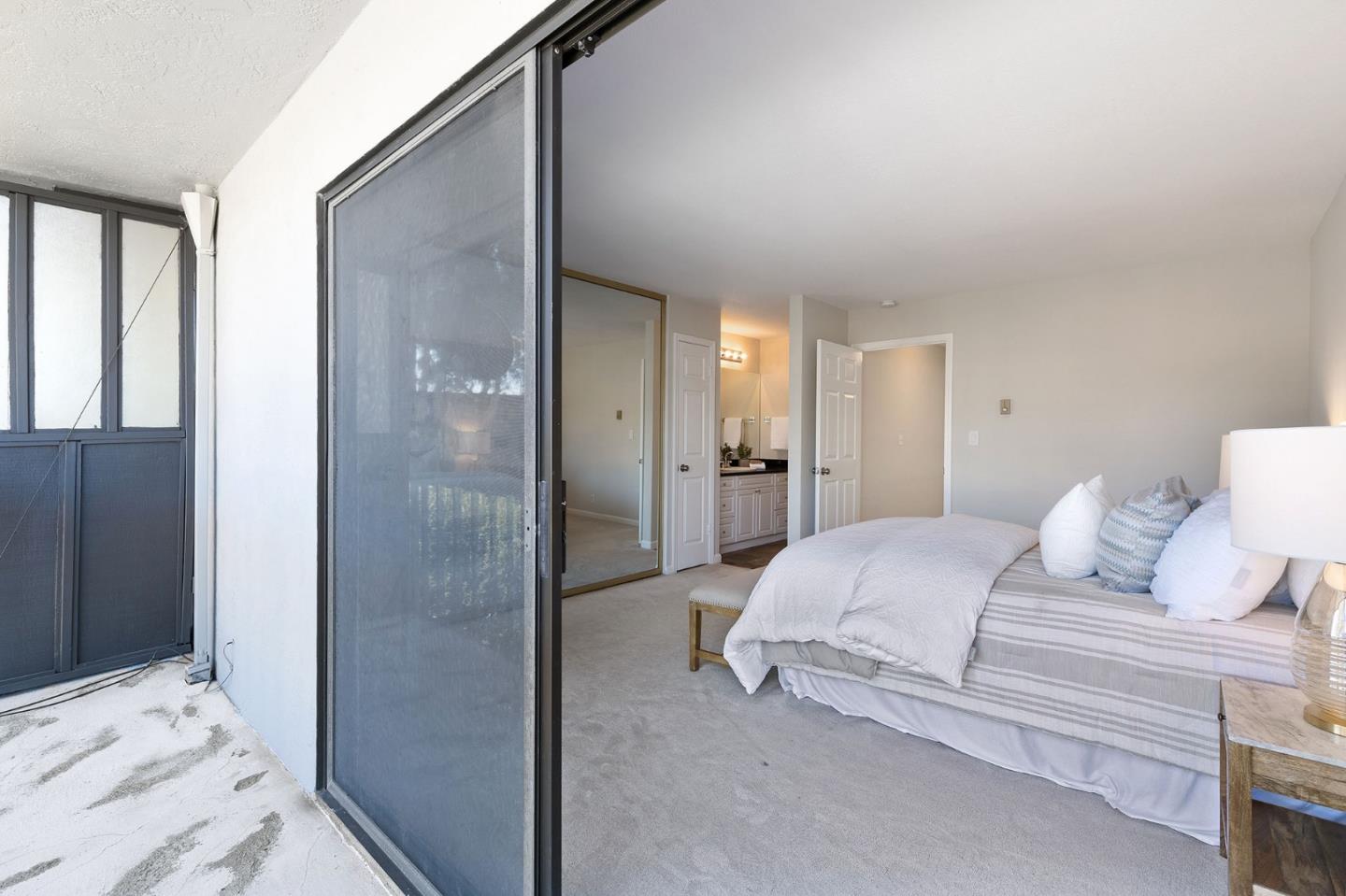 33 Park Road, Unit 13 Burlingame, CA 94010 - Photo 28 of 43 a bedroom with a bed and a bathroom