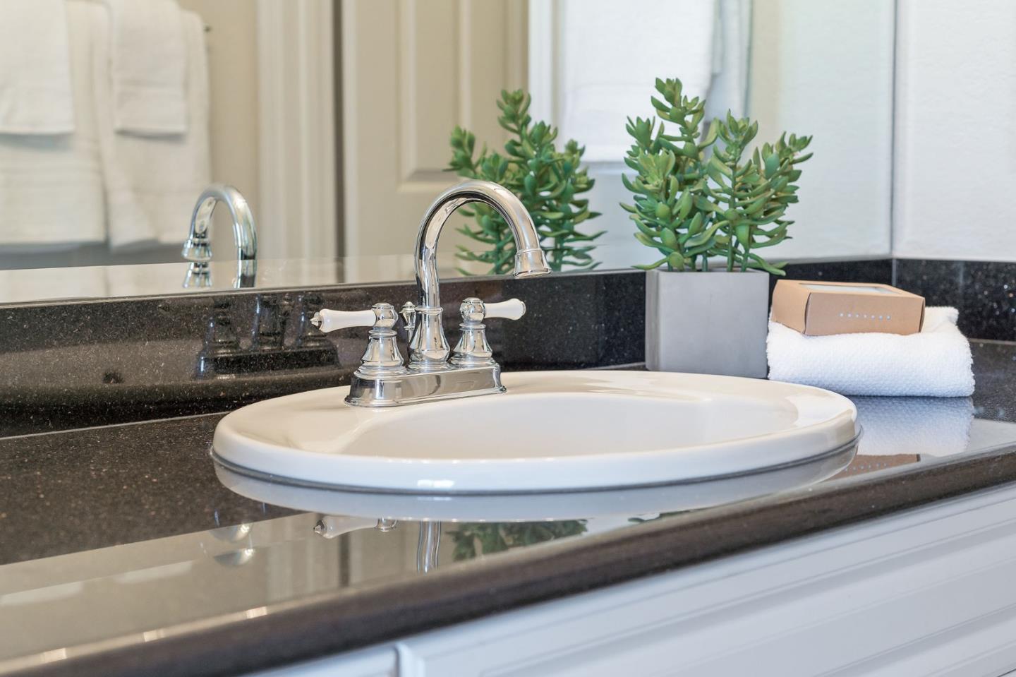 33 Park Road, Unit 13 Burlingame, CA 94010 - Photo 32 of 43 a close view of sink with a faucet and a fireplace