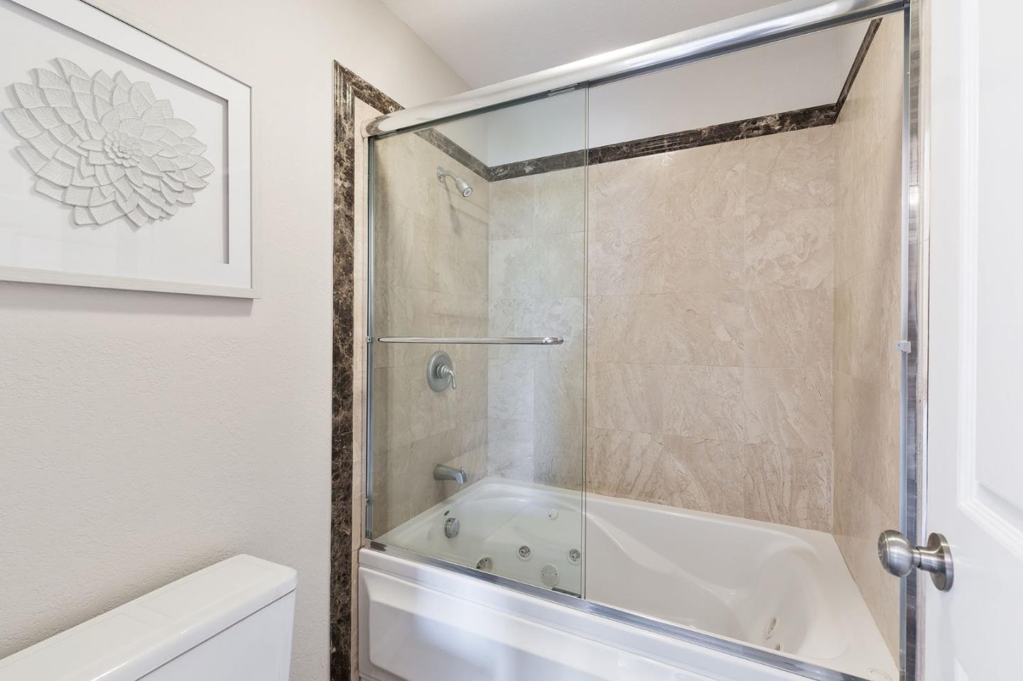 33 Park Road, Unit 13 Burlingame, CA 94010 - Photo 33 of 43 a bathroom with a bathtub and a shower