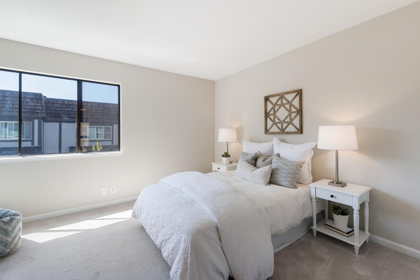 33 Park Road, Unit 13 Burlingame, CA 94010 - Photo 34 of 43 a bedroom with a bed and a painting on the wall