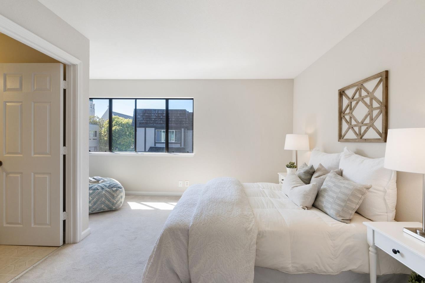 33 Park Road, Unit 13 Burlingame, CA 94010 - Photo 35 of 43 a bedroom with a bed and a window