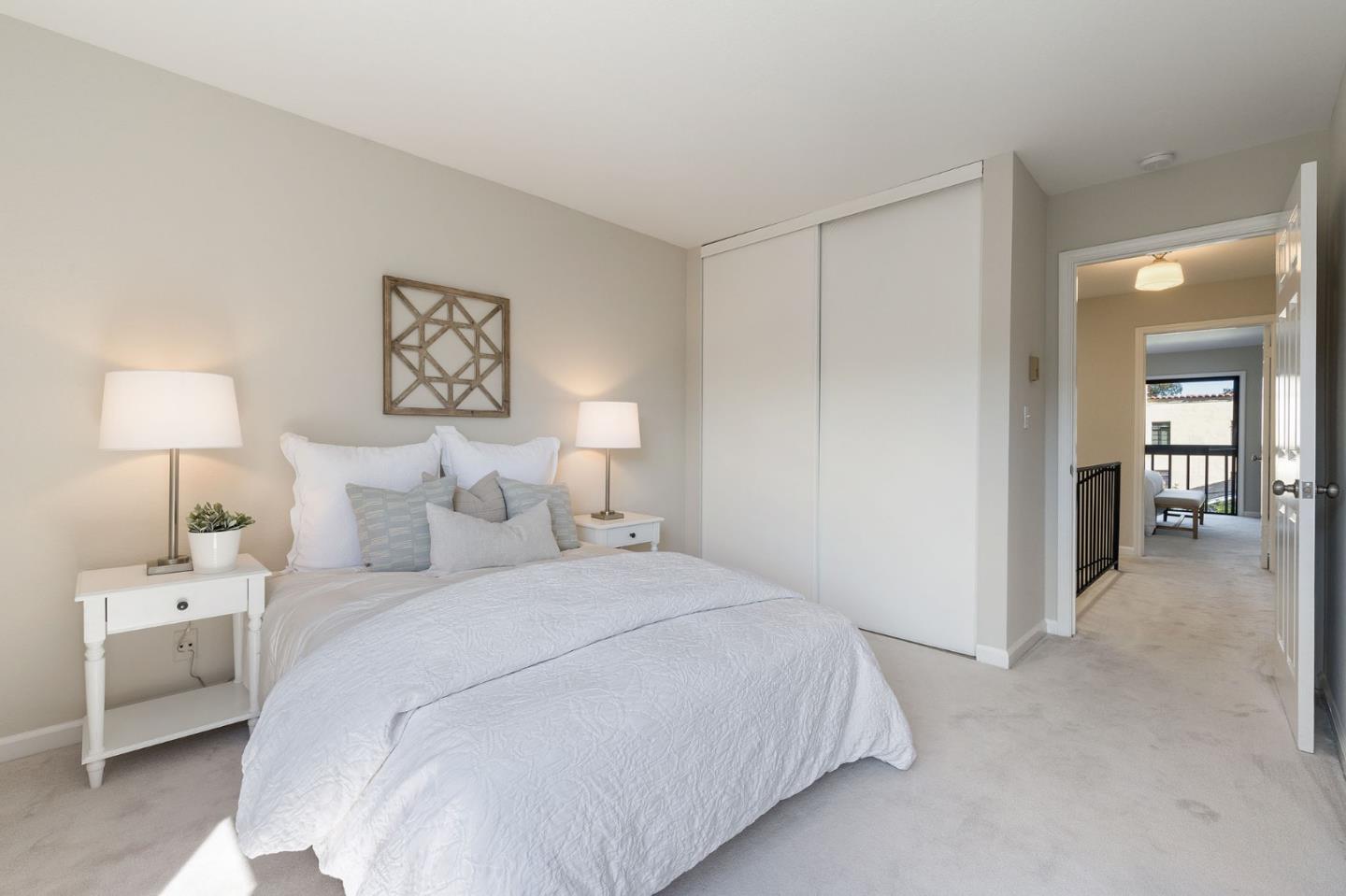 33 Park Road, Unit 13 Burlingame, CA 94010 - Photo 37 of 43 a bedroom with a bed and a lamp