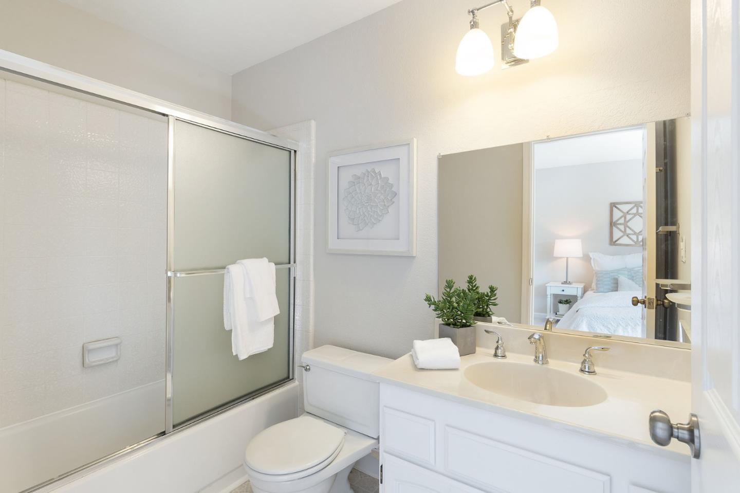 33 Park Road, Unit 13 Burlingame, CA 94010 - Photo 38 of 43 a bathroom with a sink toilet and shower