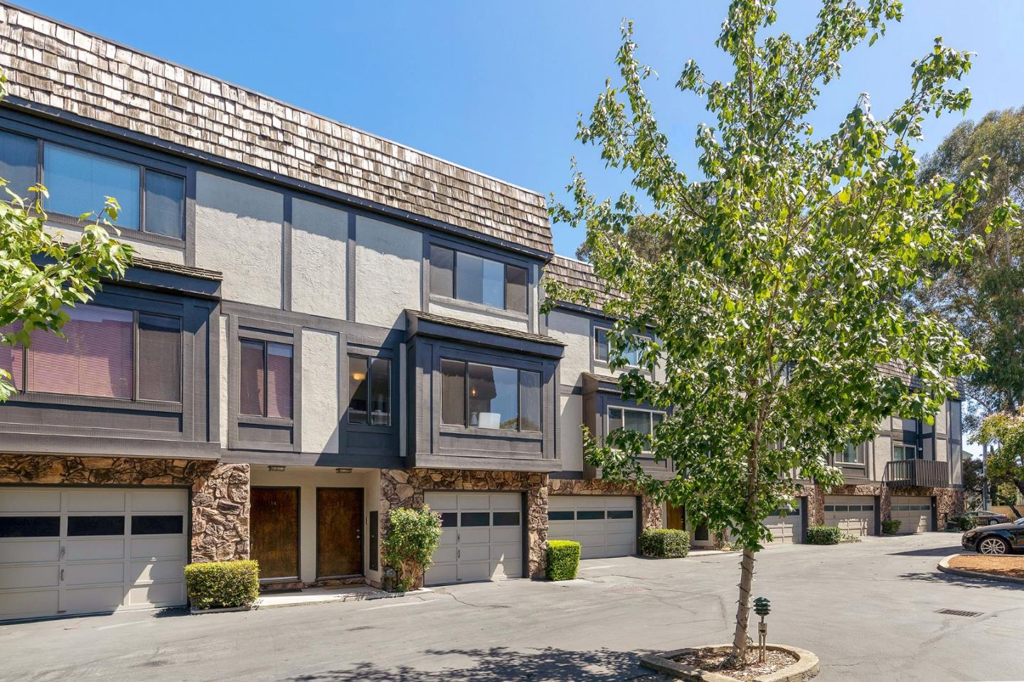 33 Park Road, Unit 13 Burlingame, CA 94010 - Photo 4 of 43 a front view of a building with street