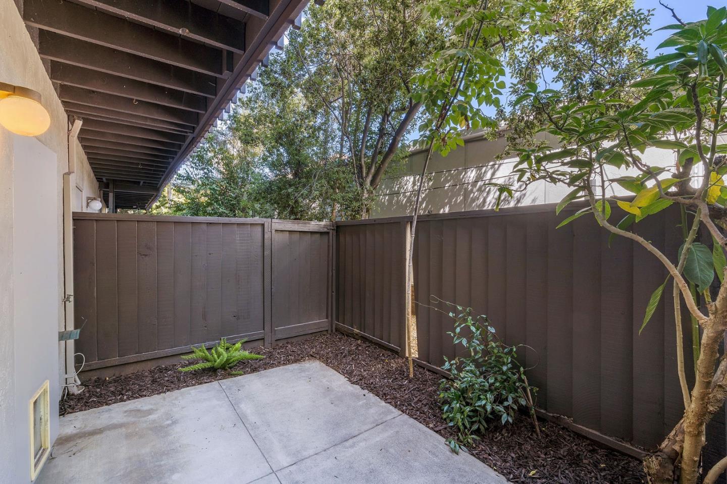 33 Park Road, Unit 13 Burlingame, CA 94010 - Photo 42 of 43 a view of a backyard