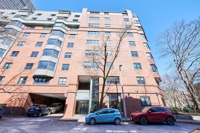 a view of a car parked in front of a building
