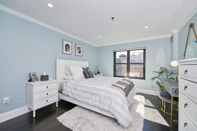 a living room with furniture a rug and a window
