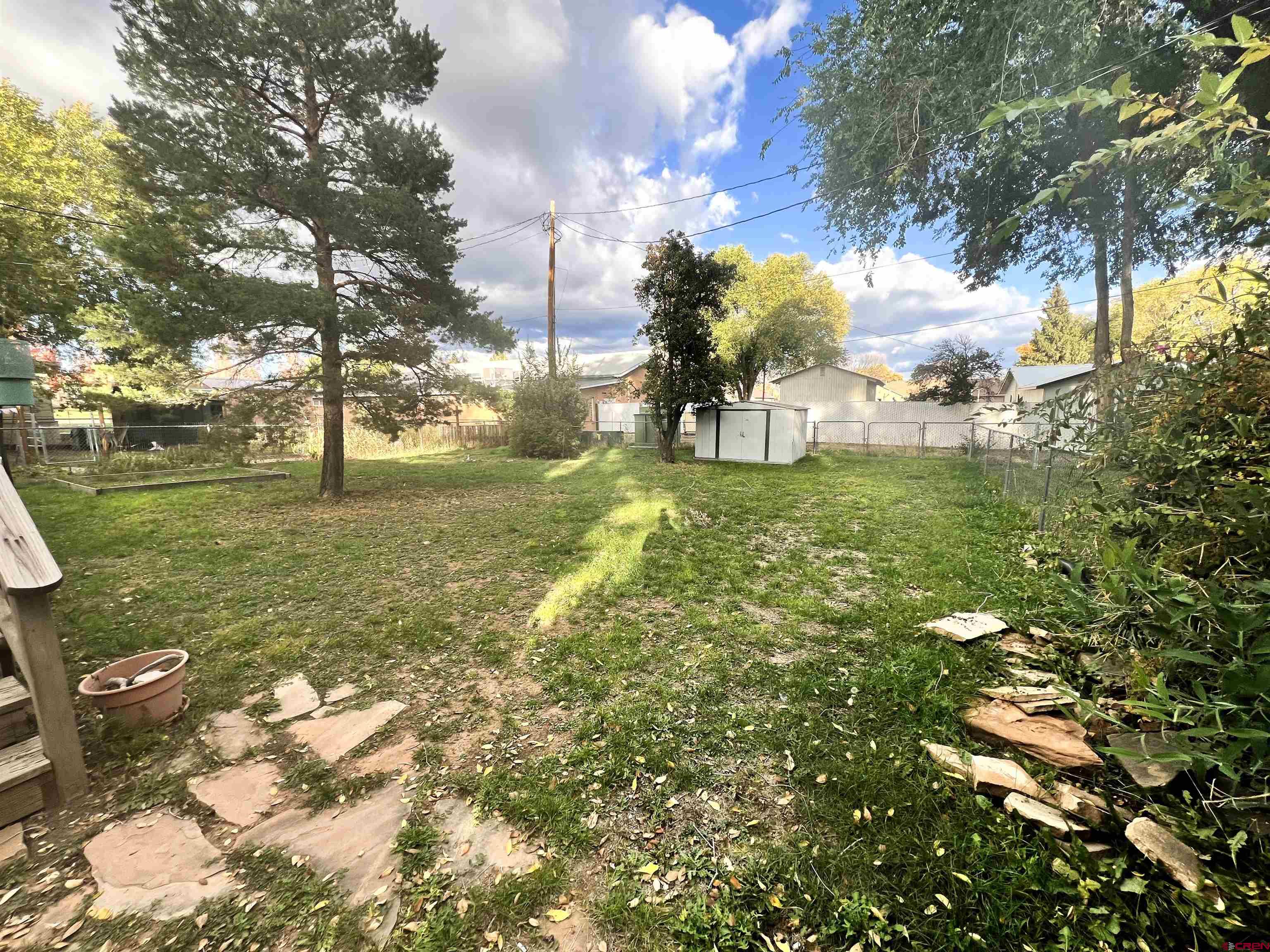 112 North Adams Street Cortez, CO 81321 - Photo 18 of 20 a view of a field with a tree