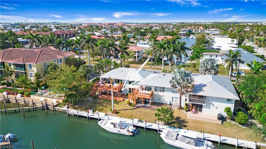 1560 Blue Point Avenue, Unit 3 Naples, FL 34102 - Photo 11 of 27 an aerial view of residential houses with outdoor space